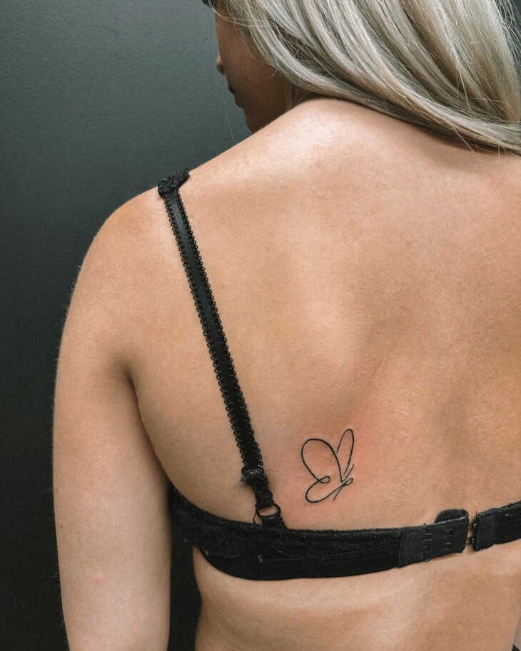 tatuagem nas costas feminina 69